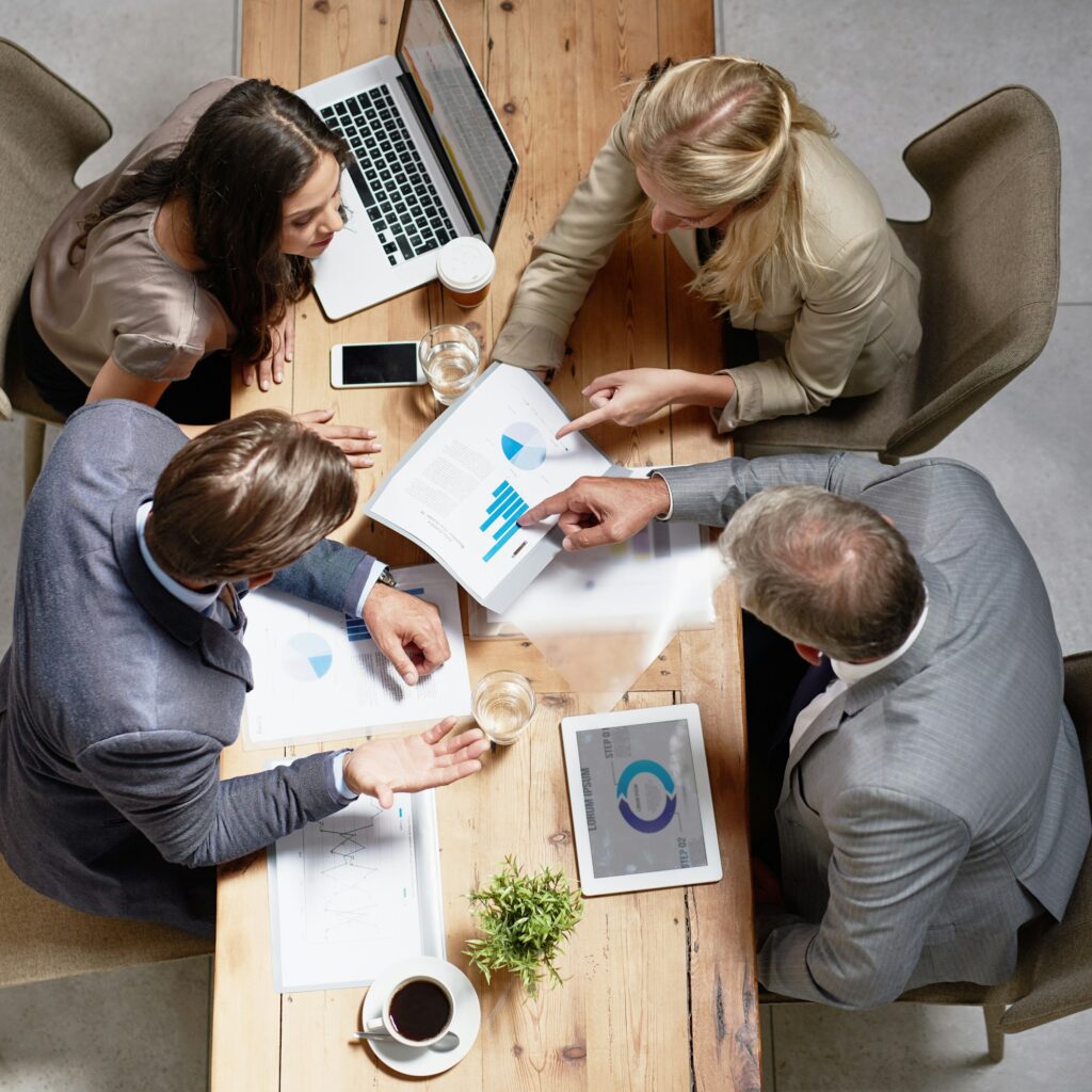 High angle shot of a group of businesspeople having a discussion in an office